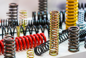 A photo of a variety of springs. Each spring has a coiled shape.
