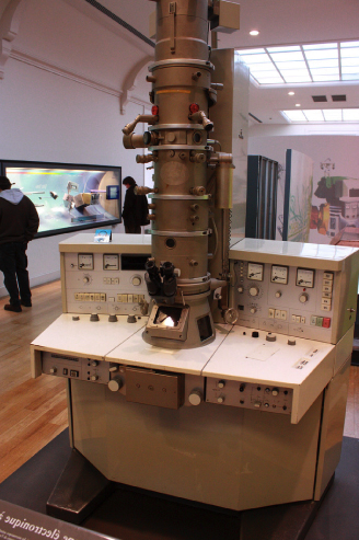 Image of an electron microscope. It is very large, roughly the size of an industrial stove.