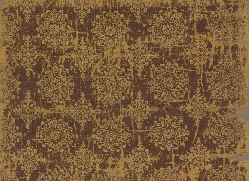 Detail of textile with floral medallions and lozenges, mid-Tang dynasty, first half of the 8th century, brocade (jin): woven silk (weft-faced compound twill), China, 150.1 high x 59.3 cm (Freer Gallery of Art, Smithsonian Institution, Washington, DC: Gift of Charles Lang Freer, F1911.597a-b)