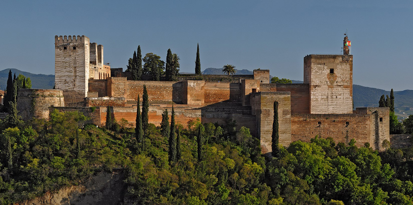 an ancient broken down castle on a hill with trees, Stable Diffusion