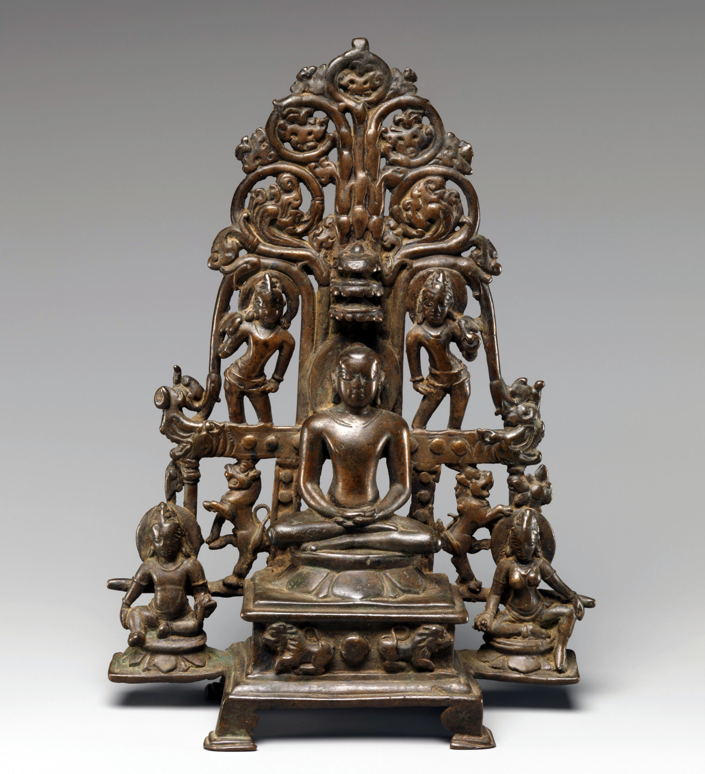 Enthroned Jina Attended by a Yaksha, a Yakshi, and Chauri-Bearers, 9th–10th century, copper alloy, India (Karnataka), 24.8 cm high (The Metropolitan Museum of Art)