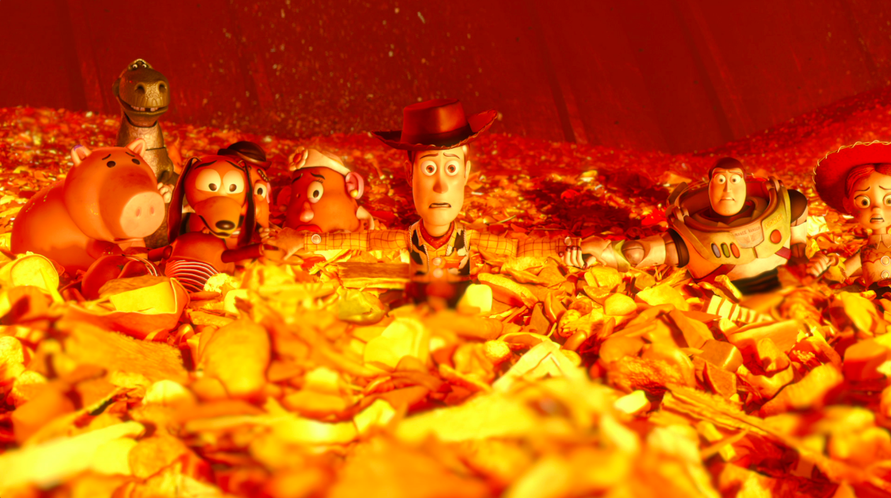 A scene from Pixar's film "Toy Story 3" where the characters are swimming in a sea of trash and look very afraid.